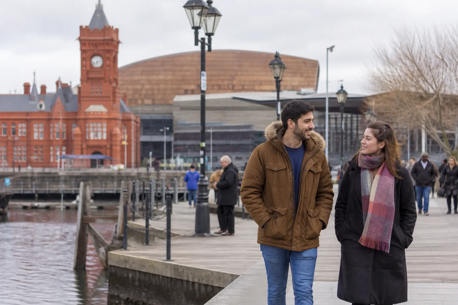 Two people meeting for coffee at a busy Cardiff city centre café